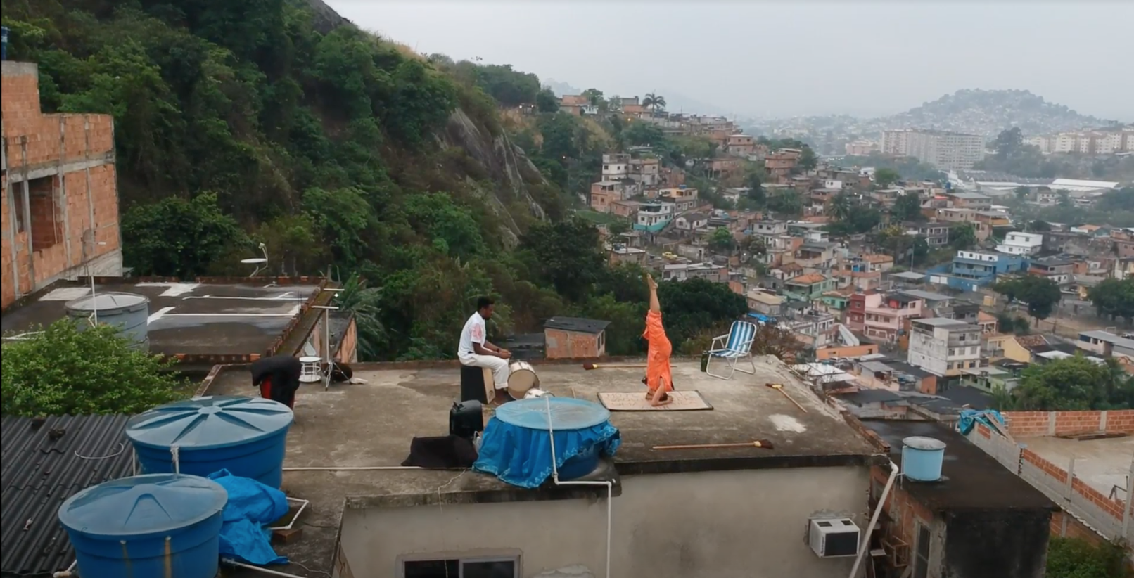 A rooftop performance overlooking Rio de Janeiro.