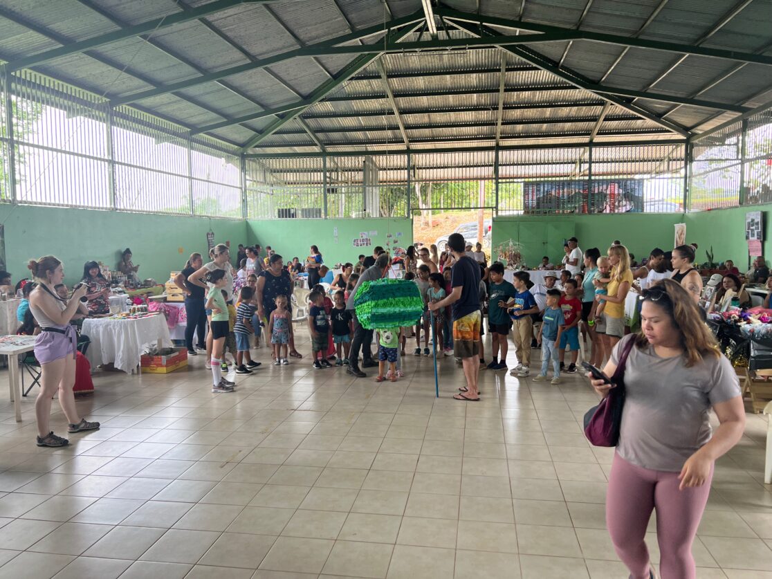 An image of a group of people gathered in a sunny room